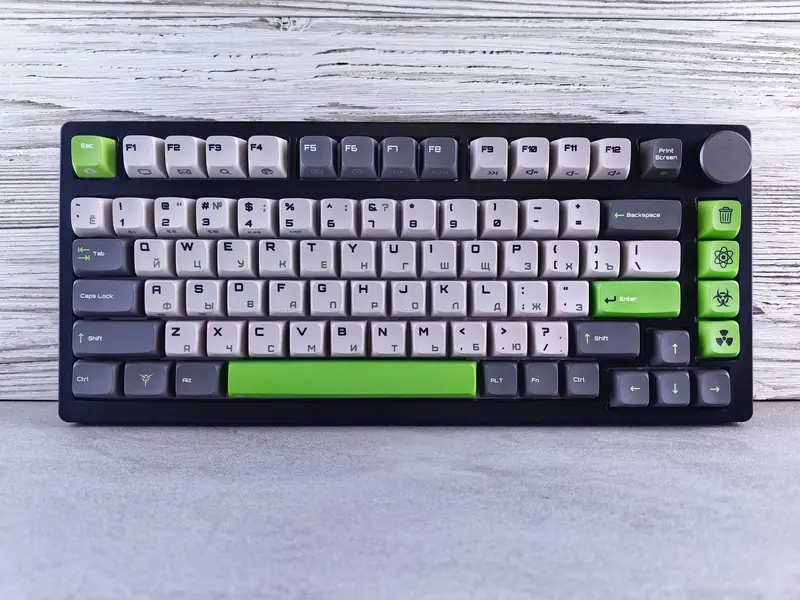 Custom mechanical keyboard with Cyrillic and English keycaps on a wooden surface